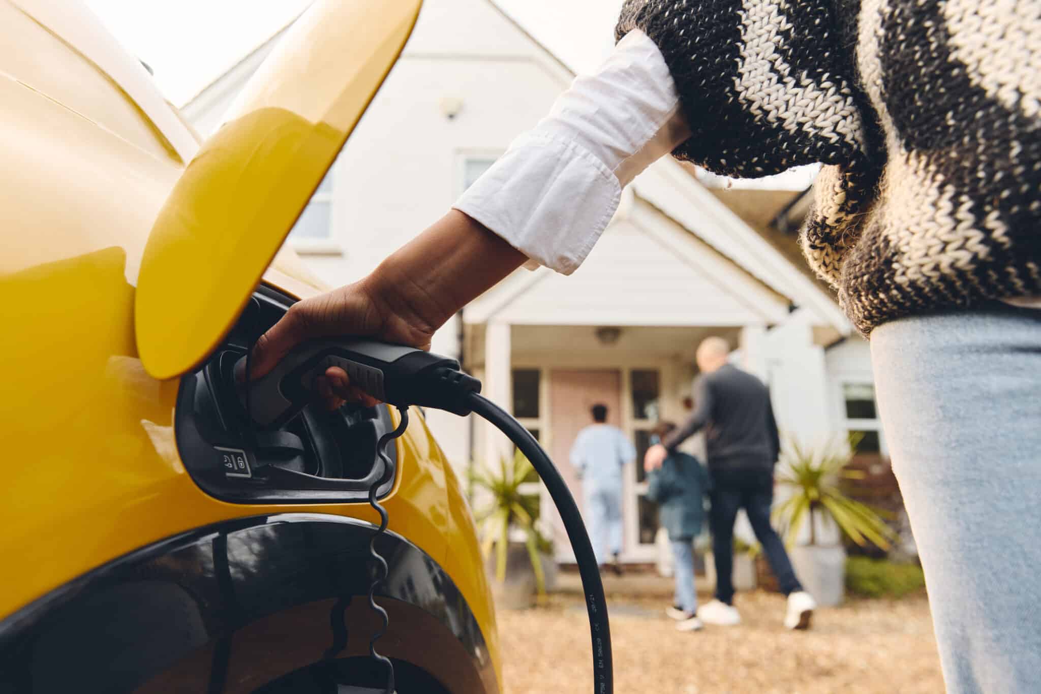 EV Chargers Plugging In EV Car At Home